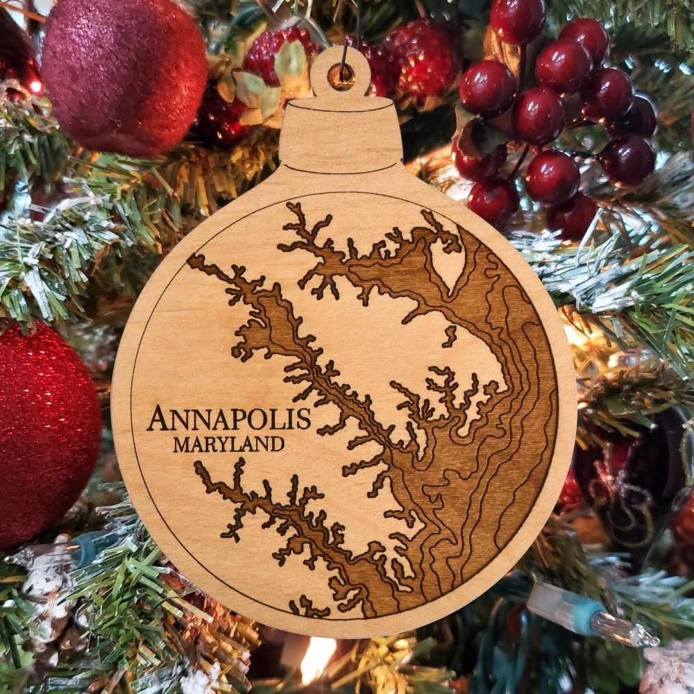 Annapolis Engraved Nautical Ornament Hanging on Christmas Tree with Red Ornaments