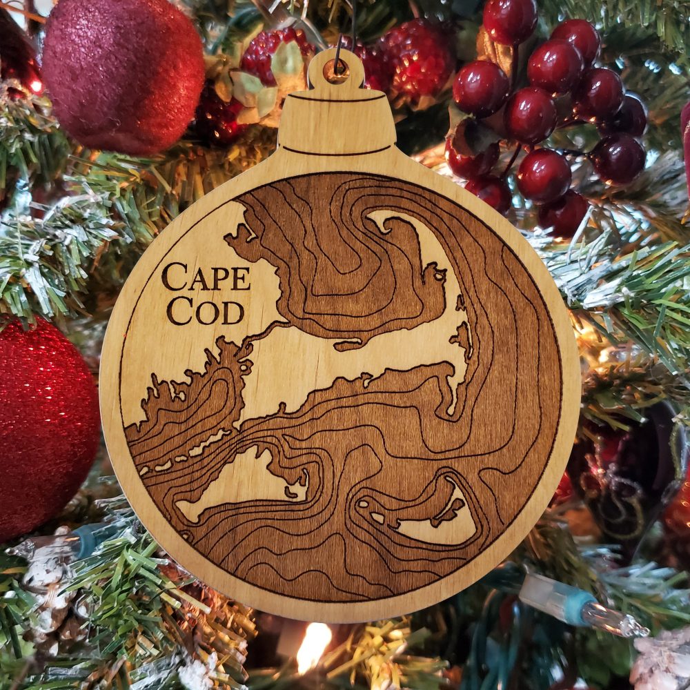 Cape Cod Engraved Nautical Ornament Hanging on Christmas Tree with Red Ornaments