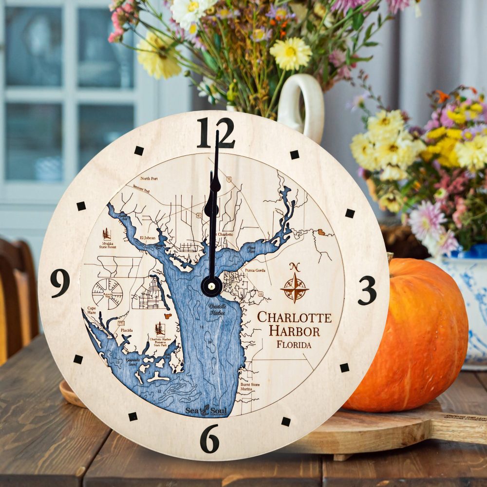 Charlotte Harbor Nautical Clock Birch Accent with Deep Blue Water on Table with Pumpkin