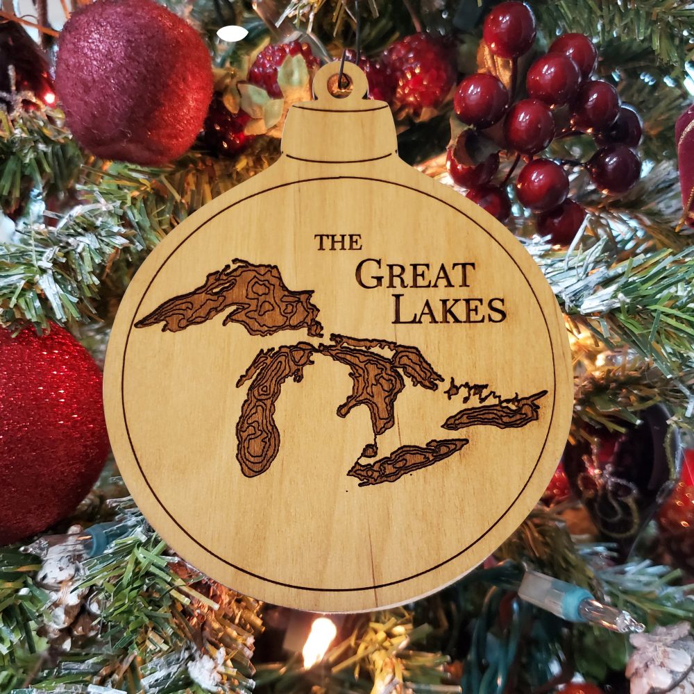 Great Lakes Engraved Nautical Ornament Hanging on Christmas Tree with Red Ornaments