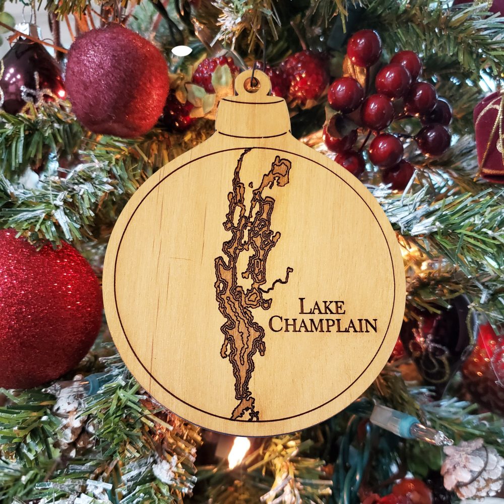 Lake Champlain Engraved Nautical Ornament Hanging on Christmas Tree with Red Ornaments