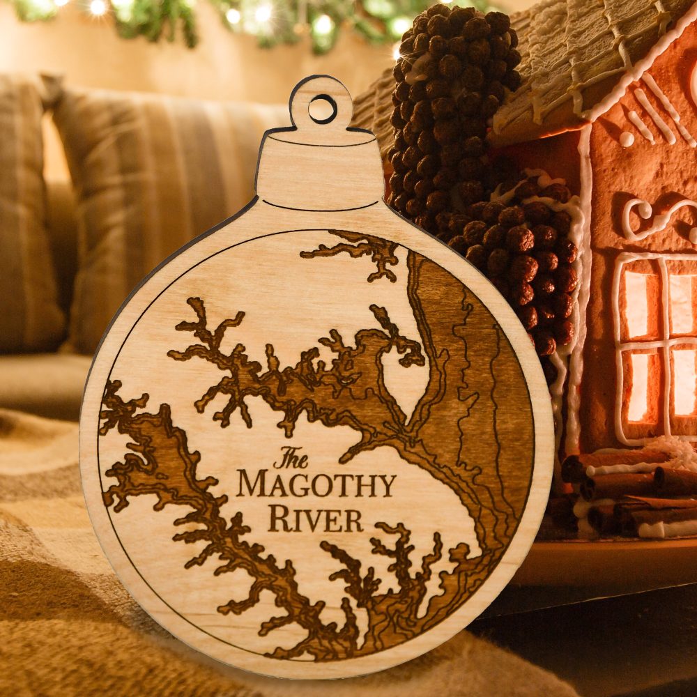 Magothy River Engraved Nautical Ornament Sitting on Table by Gingerbread House