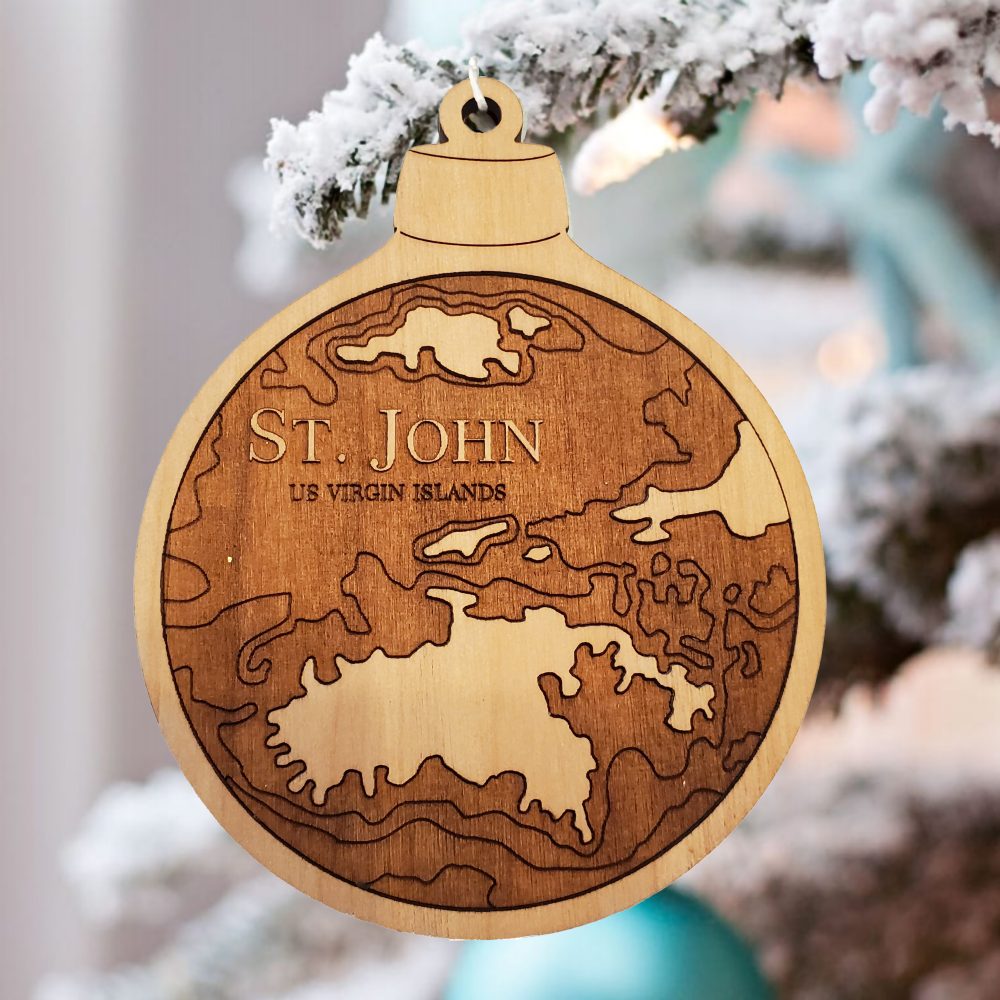 St John Engraved Nautical Ornament Hanging on Outdoor Pine Tree with Snow