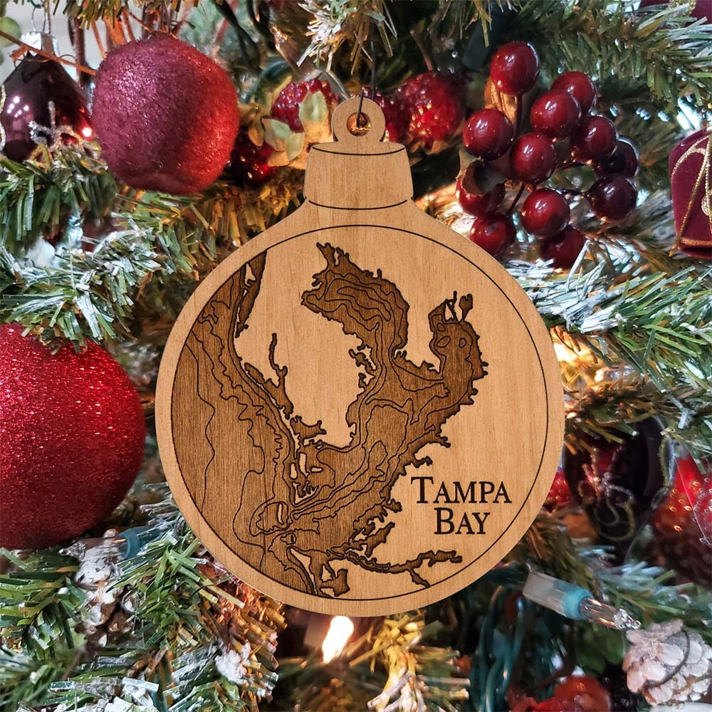Tampa Bay Engraved Nautical Ornament Hanging on Christmas Tree with Red Ornaments