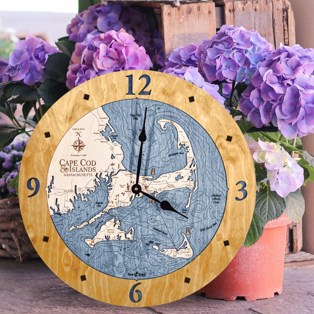 Cape Cod Nautical Clock Honey Accent with Deep Blue Water Sitting on Ground by Flower Pots