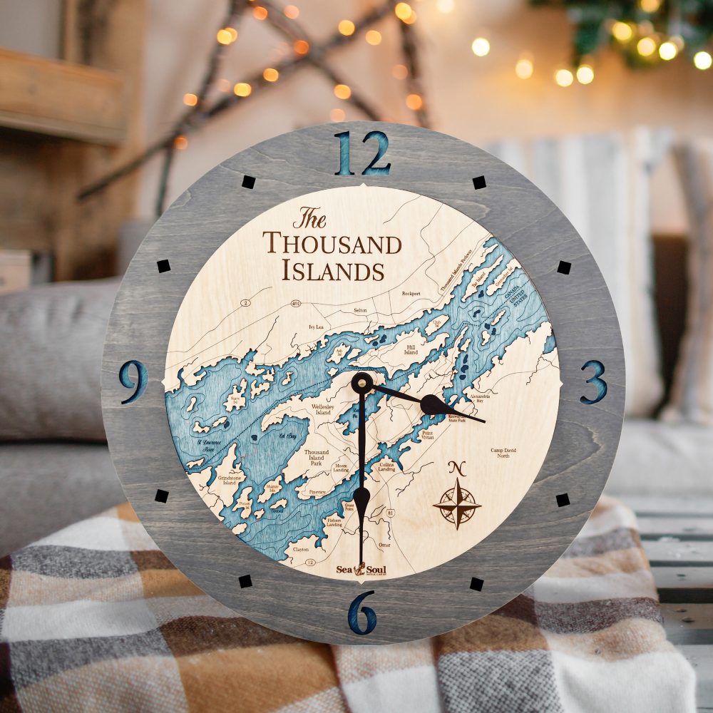 Thousand Islands Nautical Clock Driftwood Accent with Blue Green Water on Table with Blanket