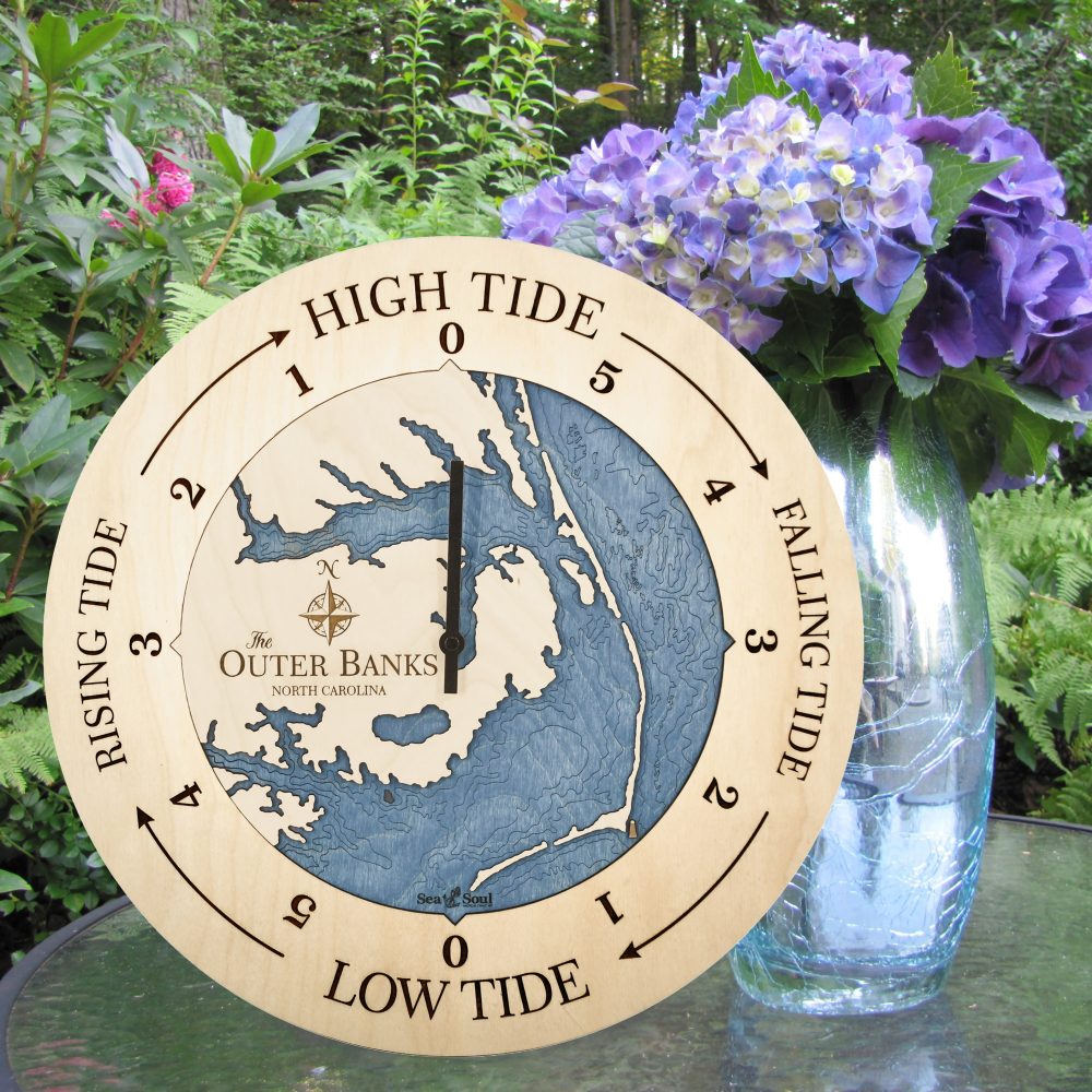 Outer Banks Tide Clock Birch Accent with Deep Blue Water Sitting on Table with Flowers