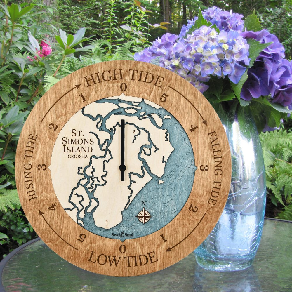St Simons Island Tide Clock Americana Accent with Blue Green Water Sitting on Outdoor Table with Flowers