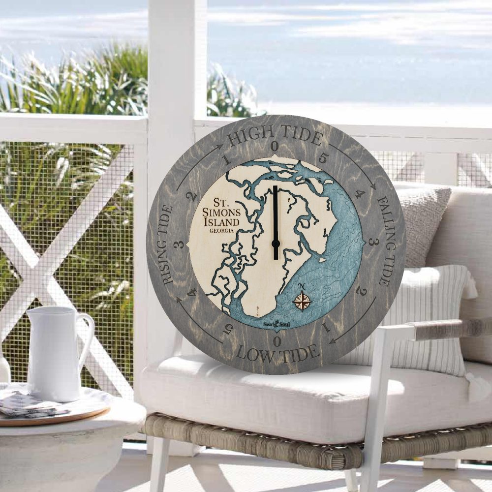 St Simons Tide Clock Driftwood Accent with Blue Green Water Sitting on Outdoor Chair by Waterfront
