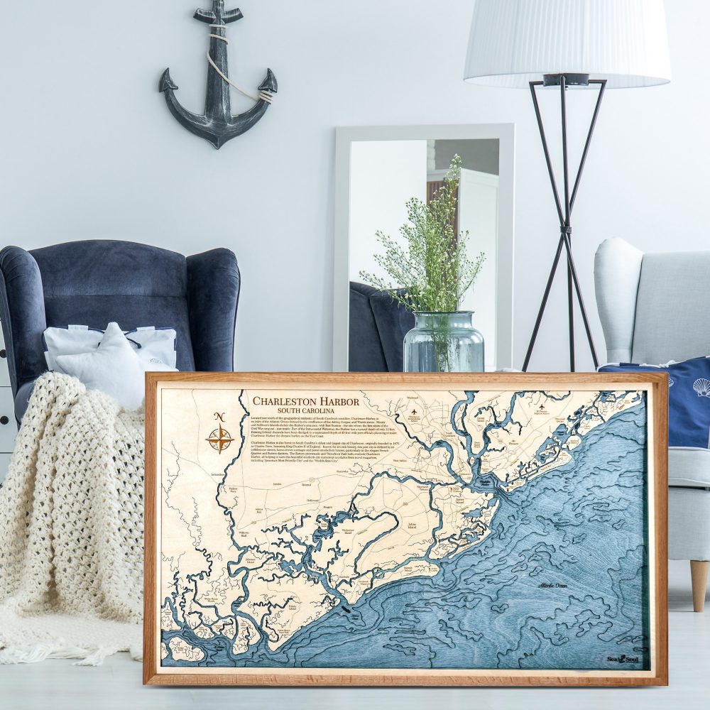 Charleston Nautical Map Wall Art Cherry Accent with Deep Blue Water Sitting on Living Room Floor by Armchair