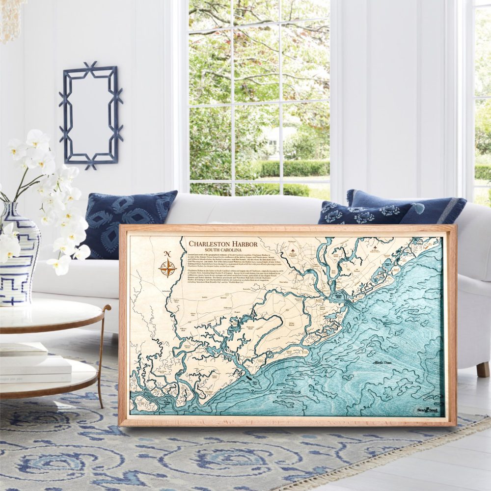 Charleston Nautical Map Wall Art Oak Accent with Blue Green Water Sitting on Living Room Floor by Coffee Table
