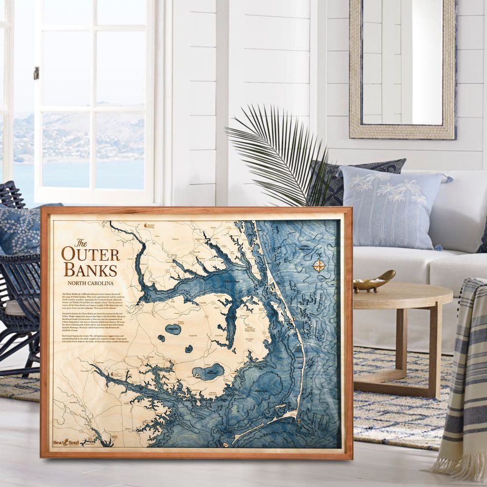 Outer Banks Nautical Map Wall Art Cherry Accent with Deep Blue Water Sitting in Living Room by Coffee Table