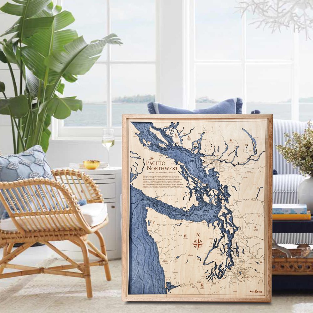 Pacific Northwest Nautical Map Wall Art Oak Accent with Deep Blue Water Sitting on Living Room Floor by Armchair and Coffee Table