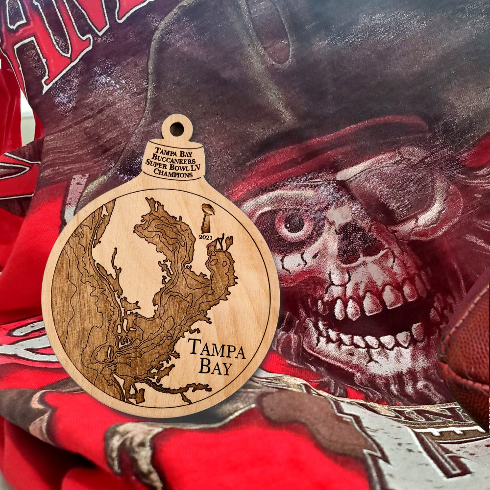 Tampa Bay Engraved Super Bowl Ornament Sitting on Buccaneers Flag