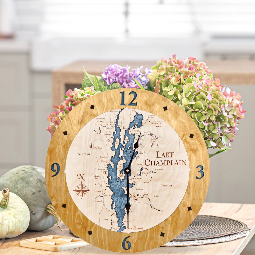 Lake Champlain Nautical Clock Honey Accent with Deep Blue Water on Table with Pumpkins and Flowers