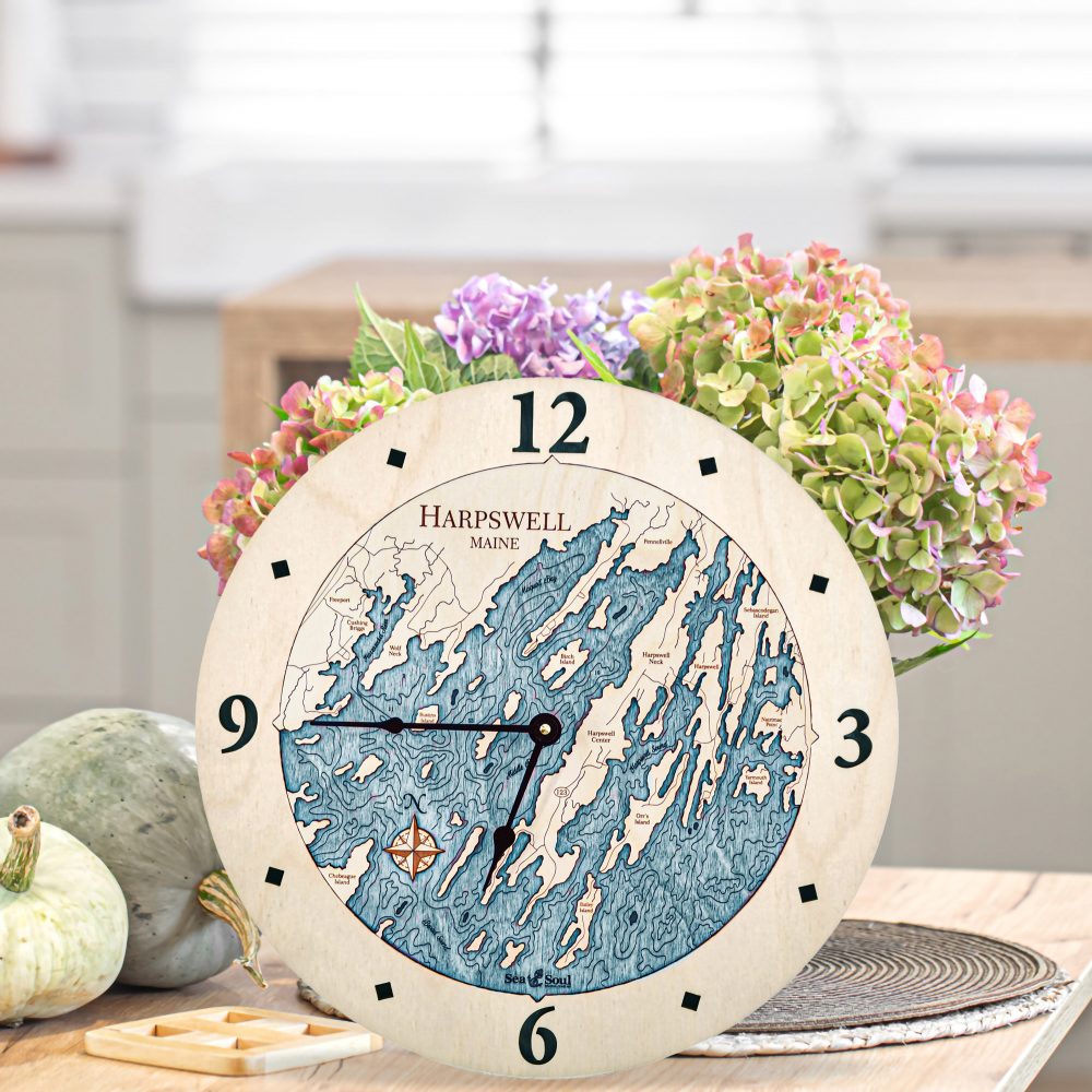 Harpswell Nautical Clock Birch Accent with Blue Green Water on Table with Flowers
