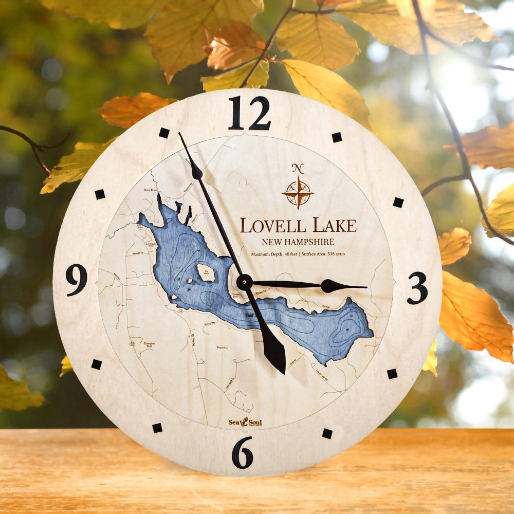 Lovell Lake Nautical Clock Birch Accent with Deep Blue Water on Table by Fall Leaves