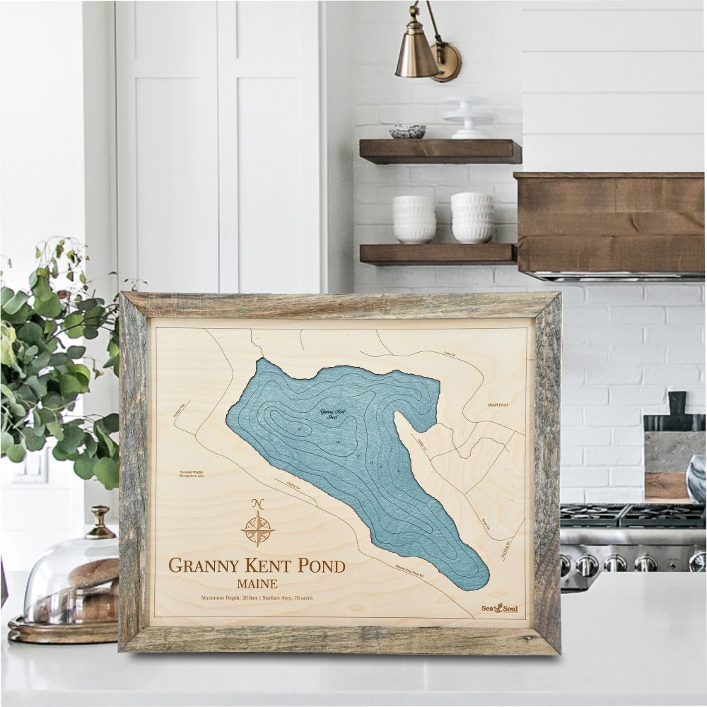 Granny Kent Pond Wall Art Rustic Pine with Blue Green Water on Countertop