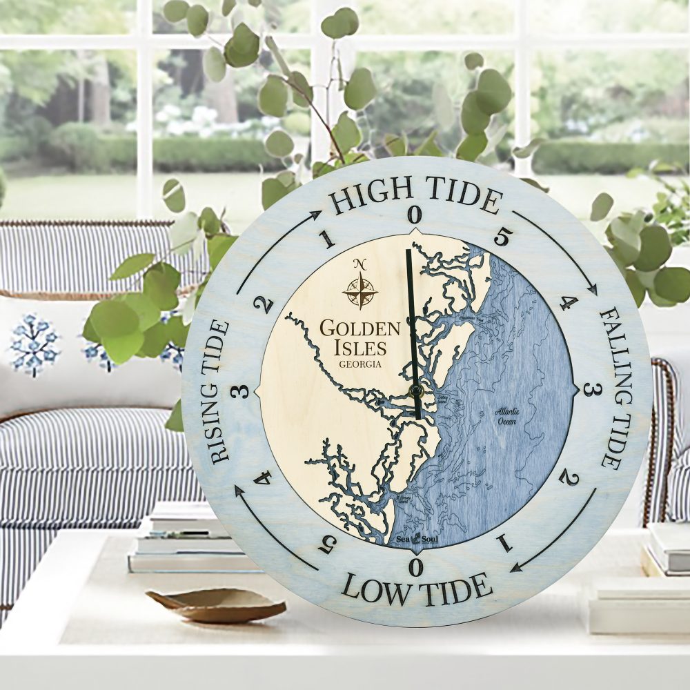 Golden Isles Tide Clock Bleach Blue Accent with Deep Blue Water on Coffee Table with Potted Plant