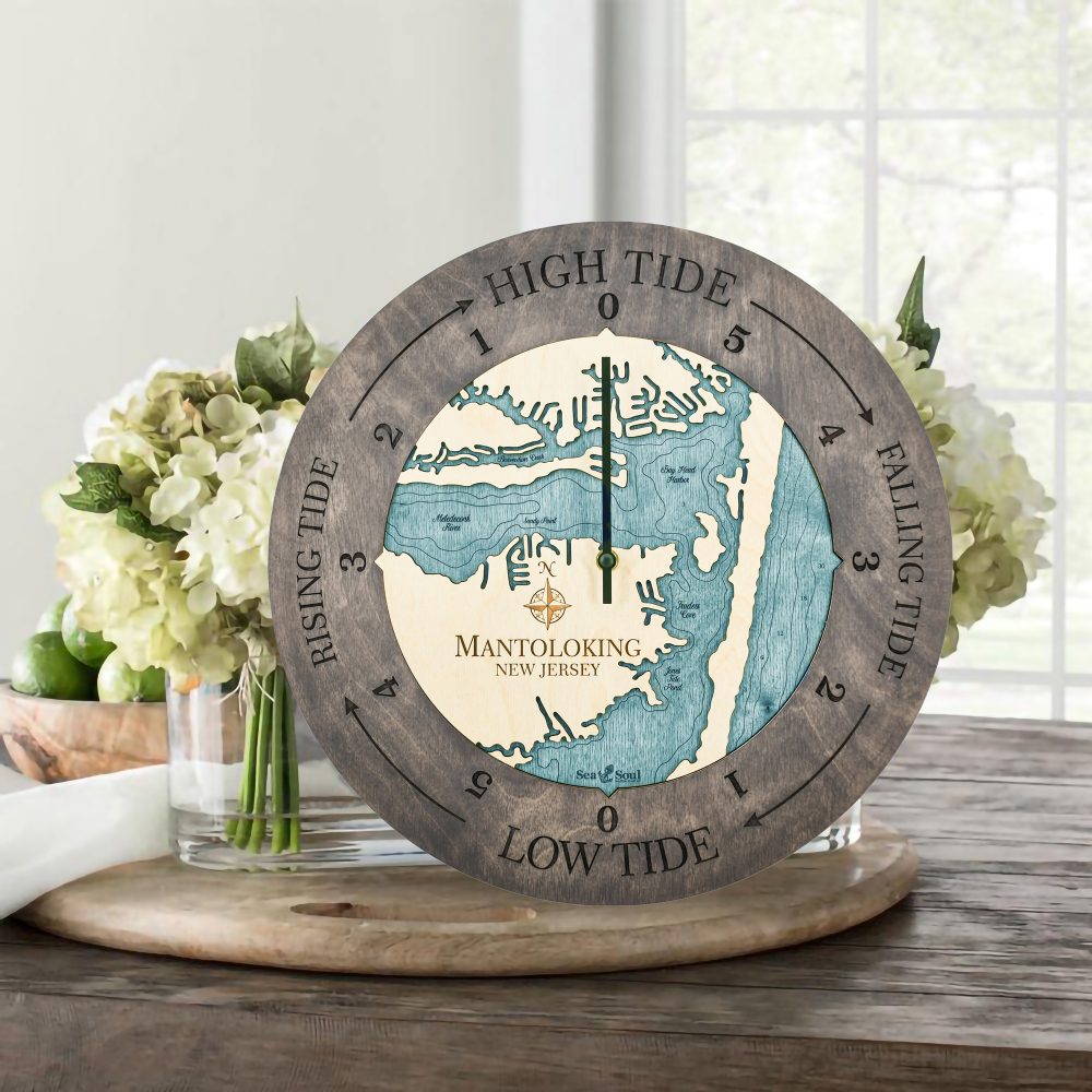 Mantoloking Tide Clock Driftwood Accent with Blue Green Water Sitting on Table with Flowers