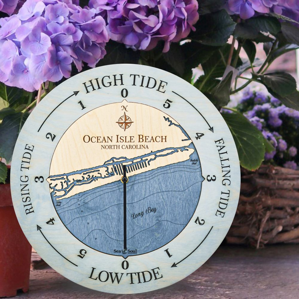 Ocean Isle Beach Tide Clock Bleach Blue Accent with Deep Blue Water Sitting by Flower Pot in Garden