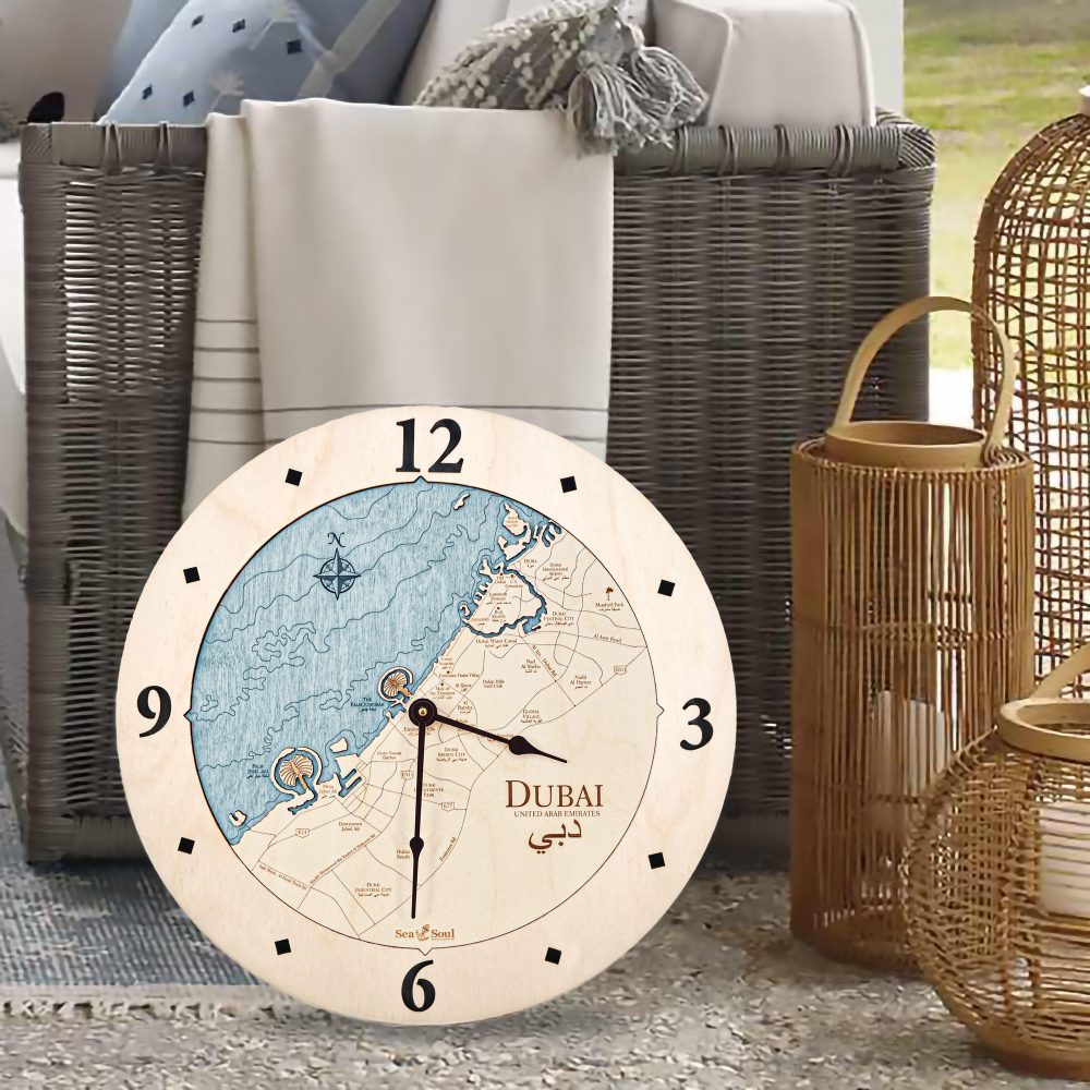 Dubai Nautical Clock Birch Accent with Blue Green Water Sitting on Floor by Wicker Chair