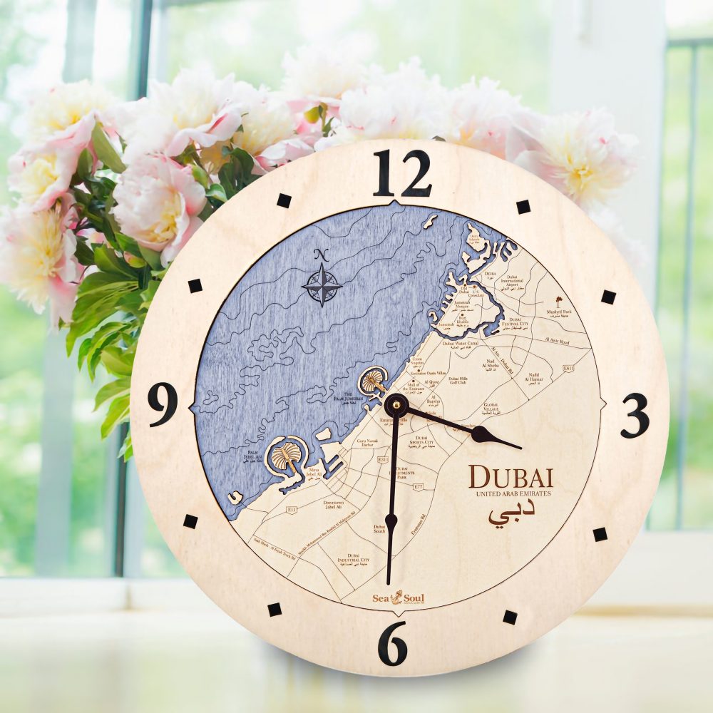 Dubai Nautical Clock Birch Accent with Deep Blue Water Sitting on Windowsill with Flowers