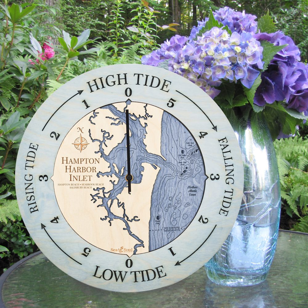 Hampton Harbor Inlet Tide Clock Bleach Blue Accent with Deep Blue Water Sitting on Table with Flowers