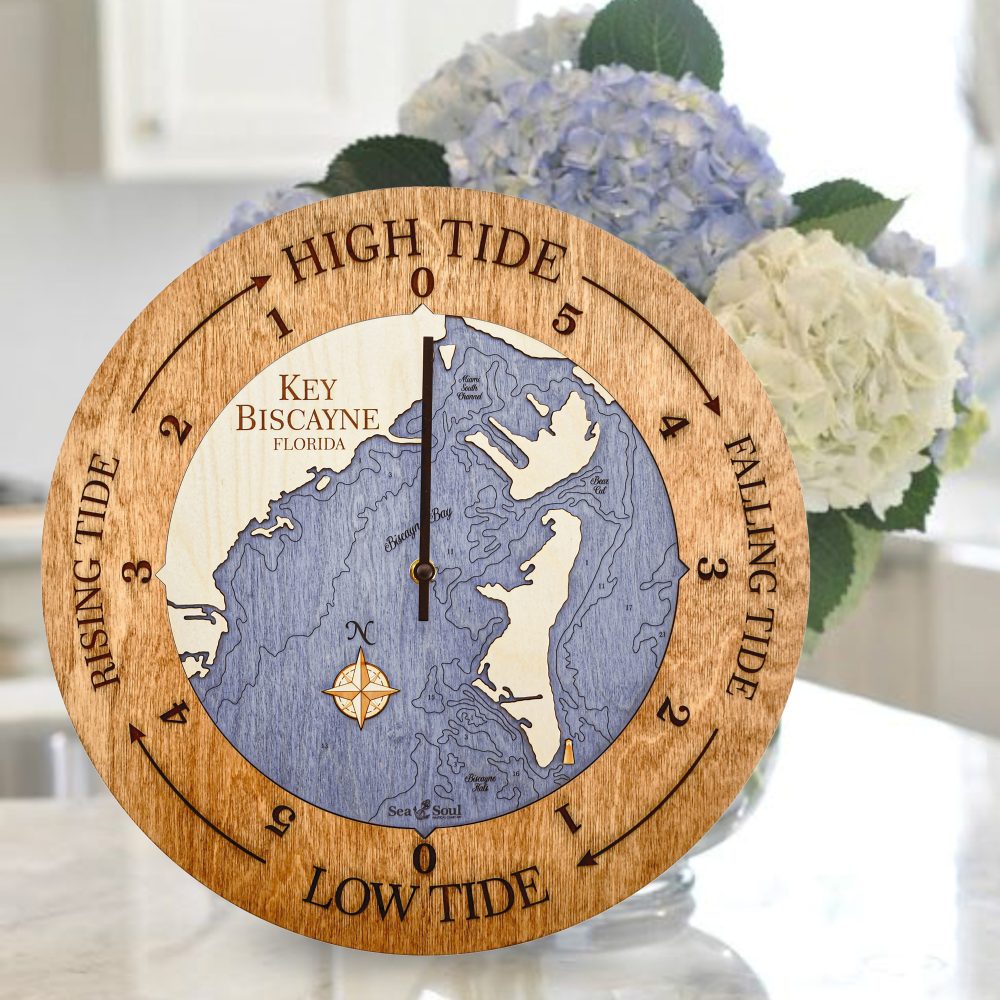 Key Biscayne Tide Clock Americana Accent with Deep Blue Water Sitting on Countertop with Flowers