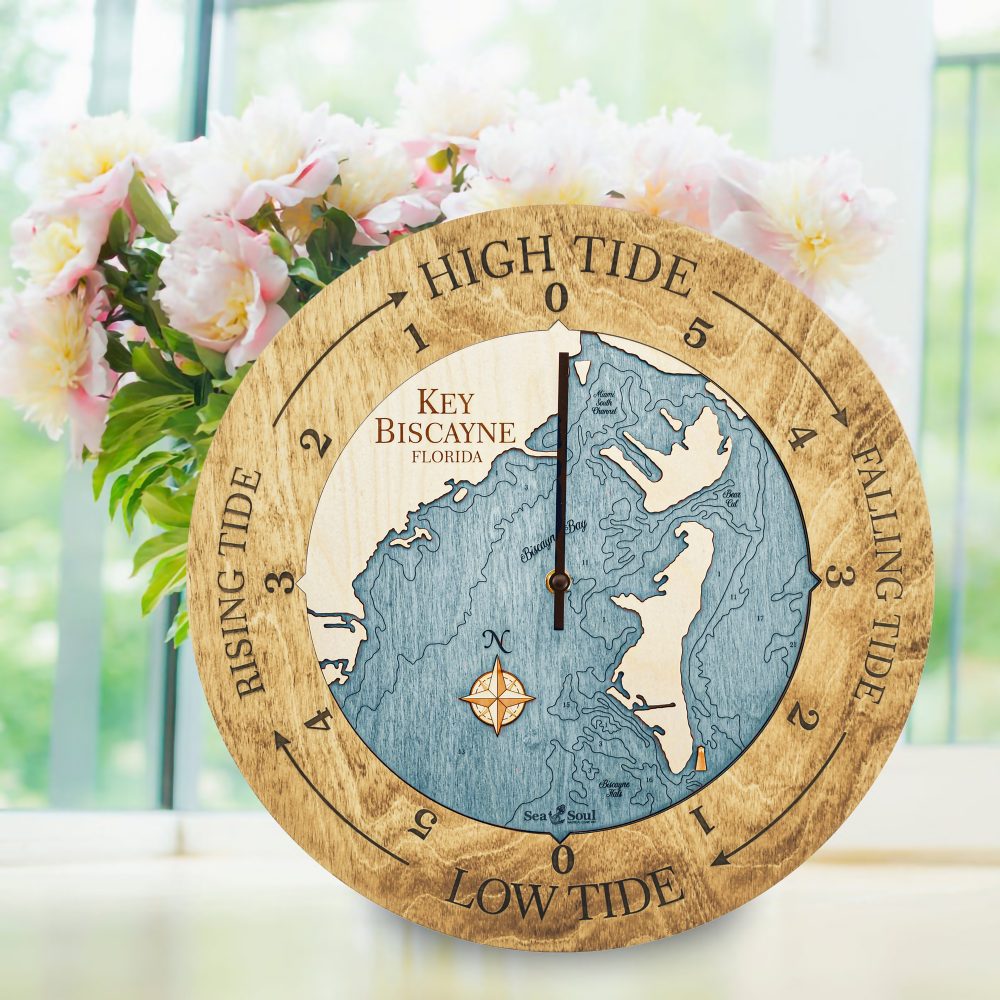 Key Biscayne Tide Clock Honey Accent with Blue Green Water Sitting on Windowsill with Flowers