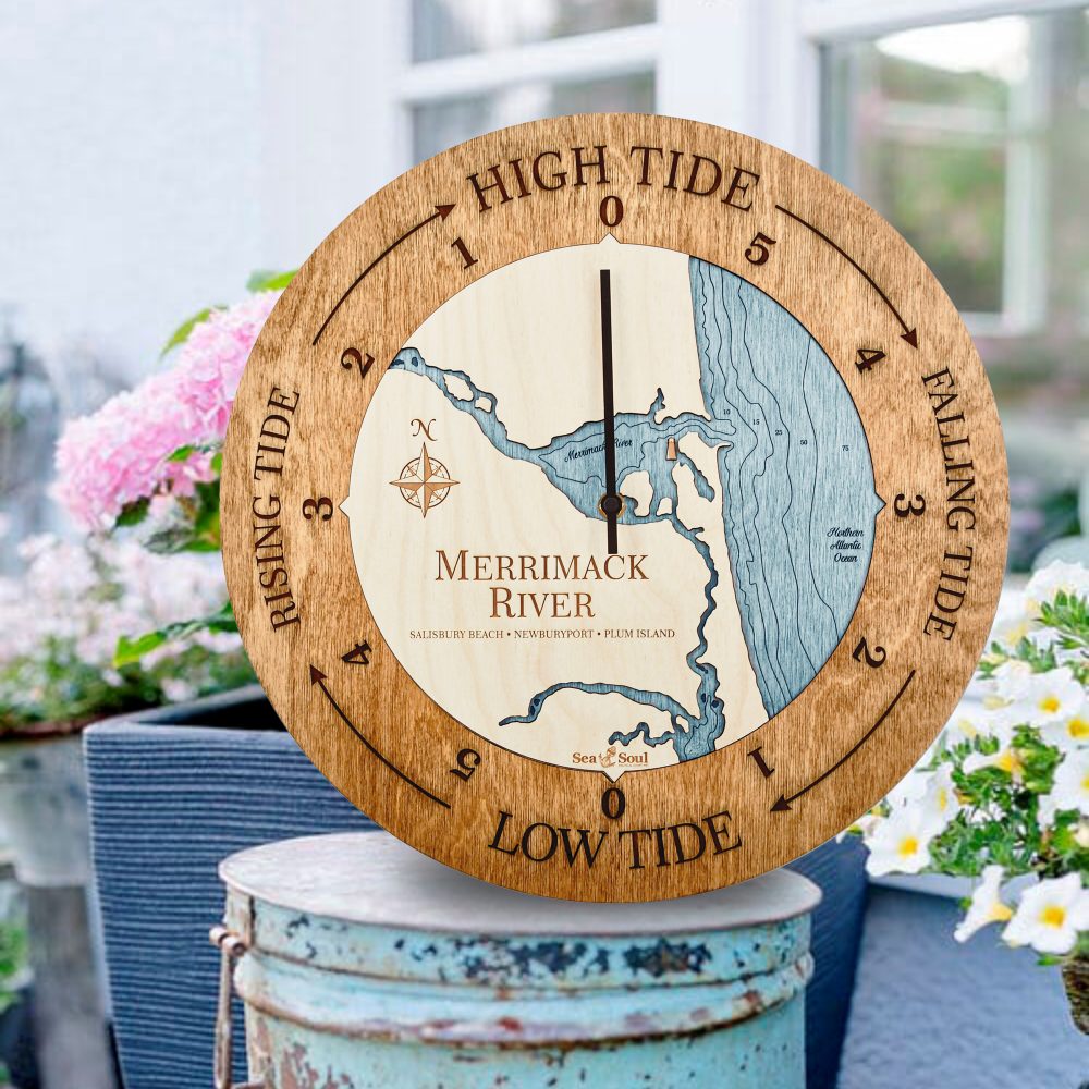 Merrimack River Tide Clock Americana Accent with Blue Green Water Sitting on Bucket Outdoors with Flowers