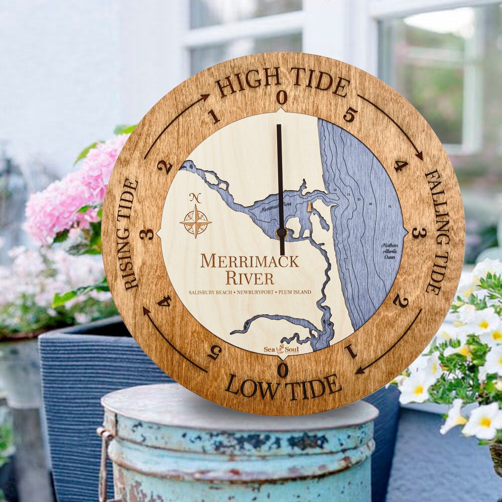 Merrimack River Tide Clock Americana Accent with Deep Blue Water Sitting on Bucket Outdoors with Flowers