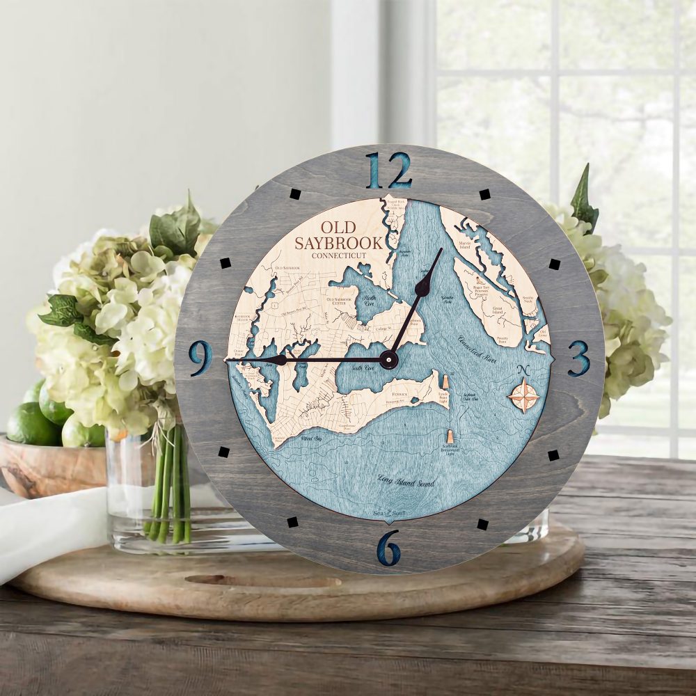 Old Saybrook Nautical Clock Driftwood Accent with Blue Green Water Sitting on Table with Flowers