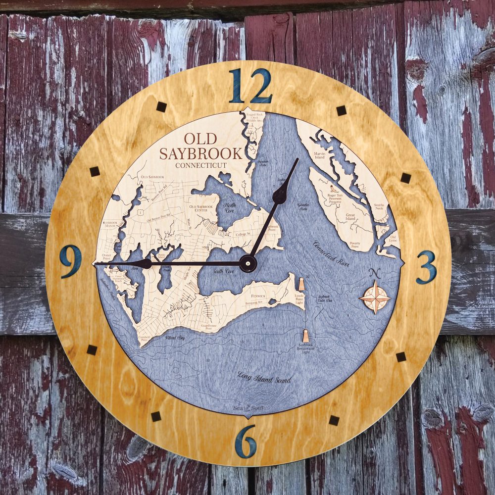 Old Saybrook Nautical Clock Honey Accent with Deep Blue Water Hanging on Fence