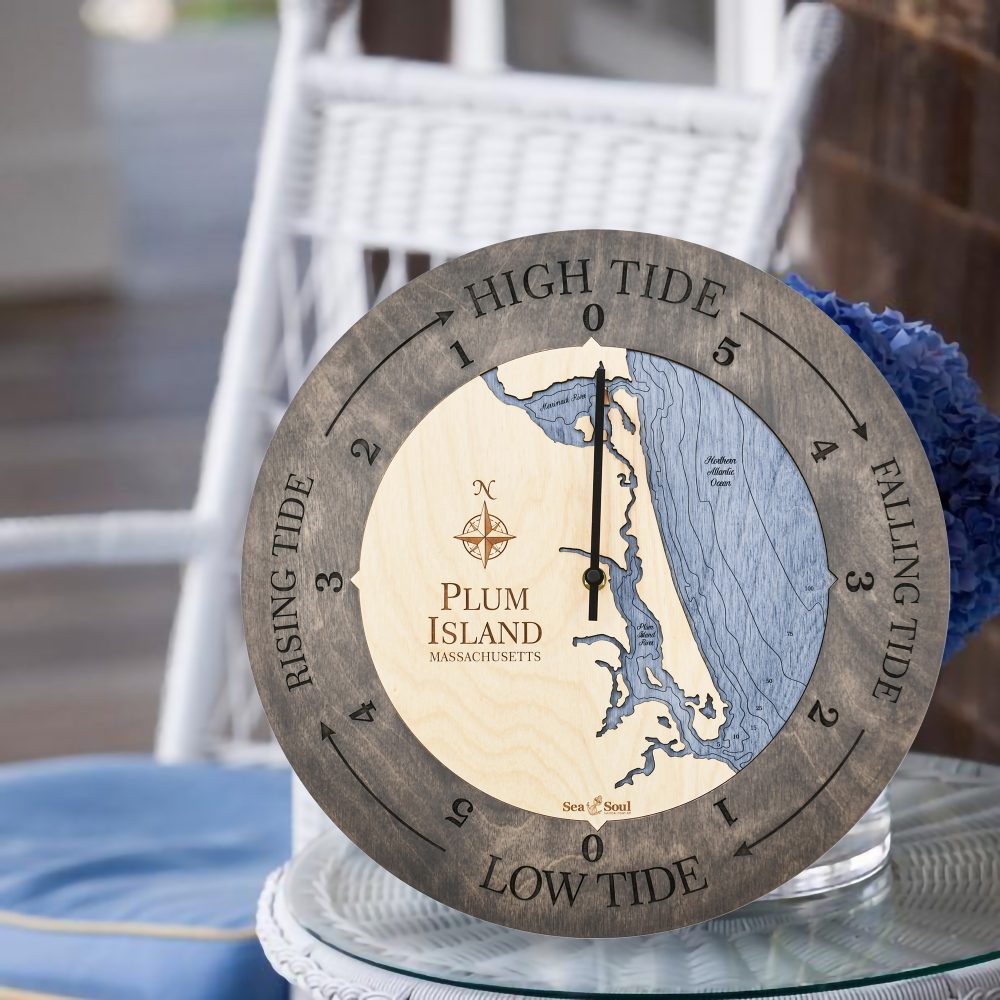 Plum Island Tide Clock Driftwood Accent with Deep Blue Water Sitting on Table with Flowers
