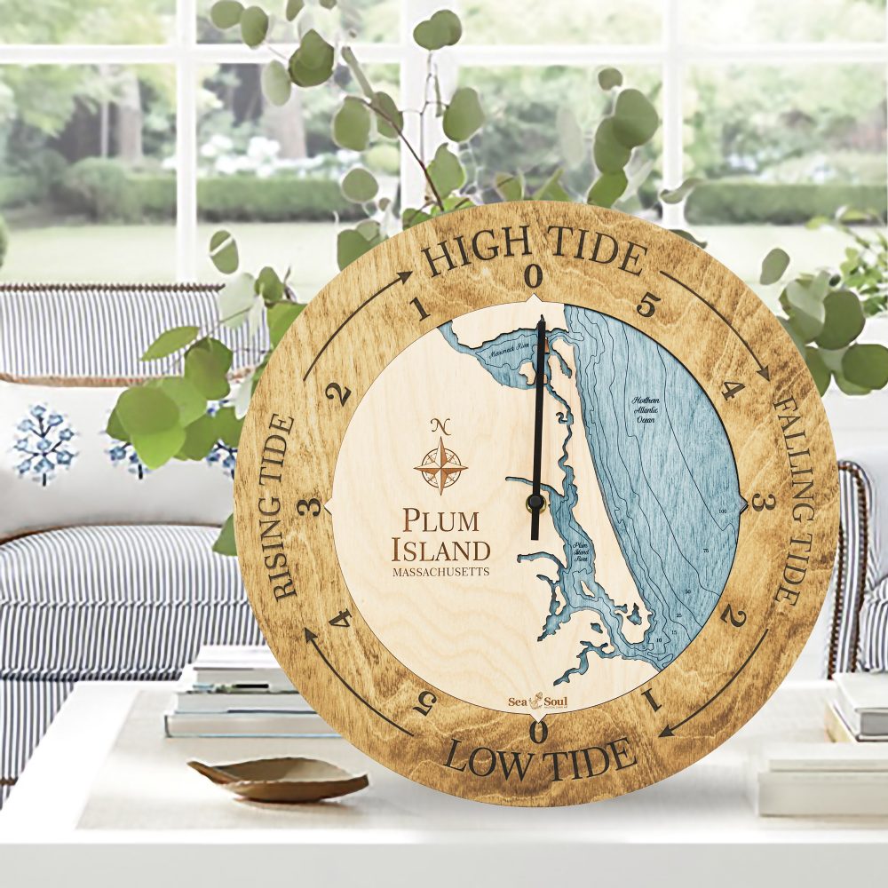 Plum Island Tide Clock Honey Accent with Blue Green Water Sitting on Coffee Table