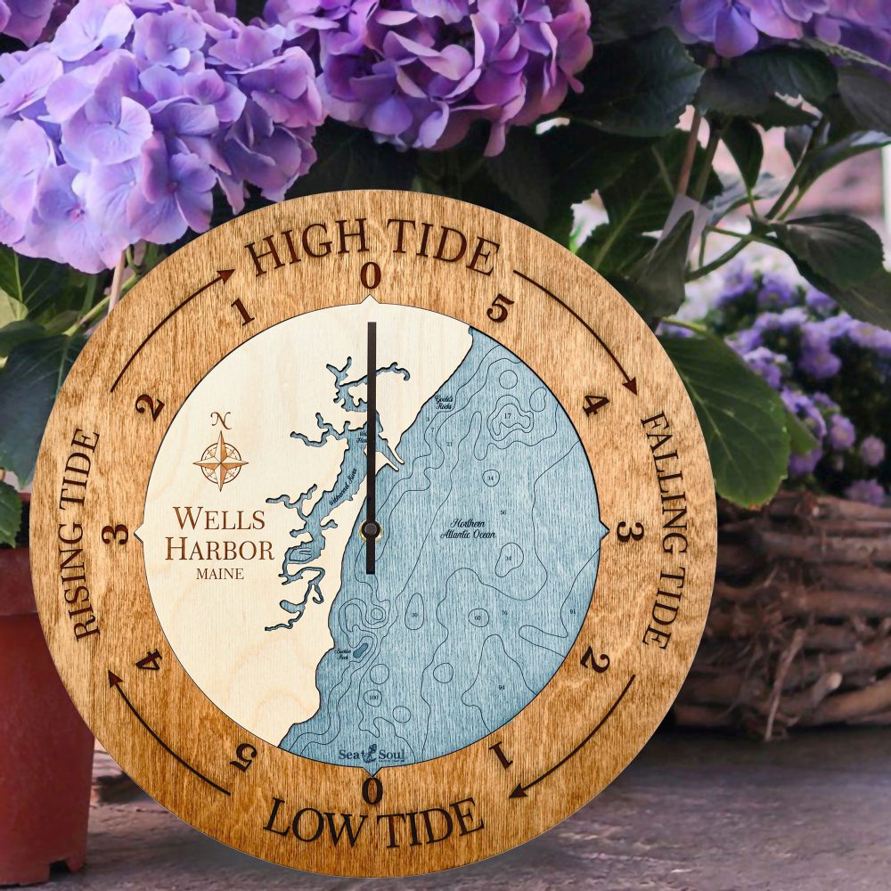 Wells Harbor Tide Clock Americana Accent with Blue Green Water Sitting on Ground by Flowers