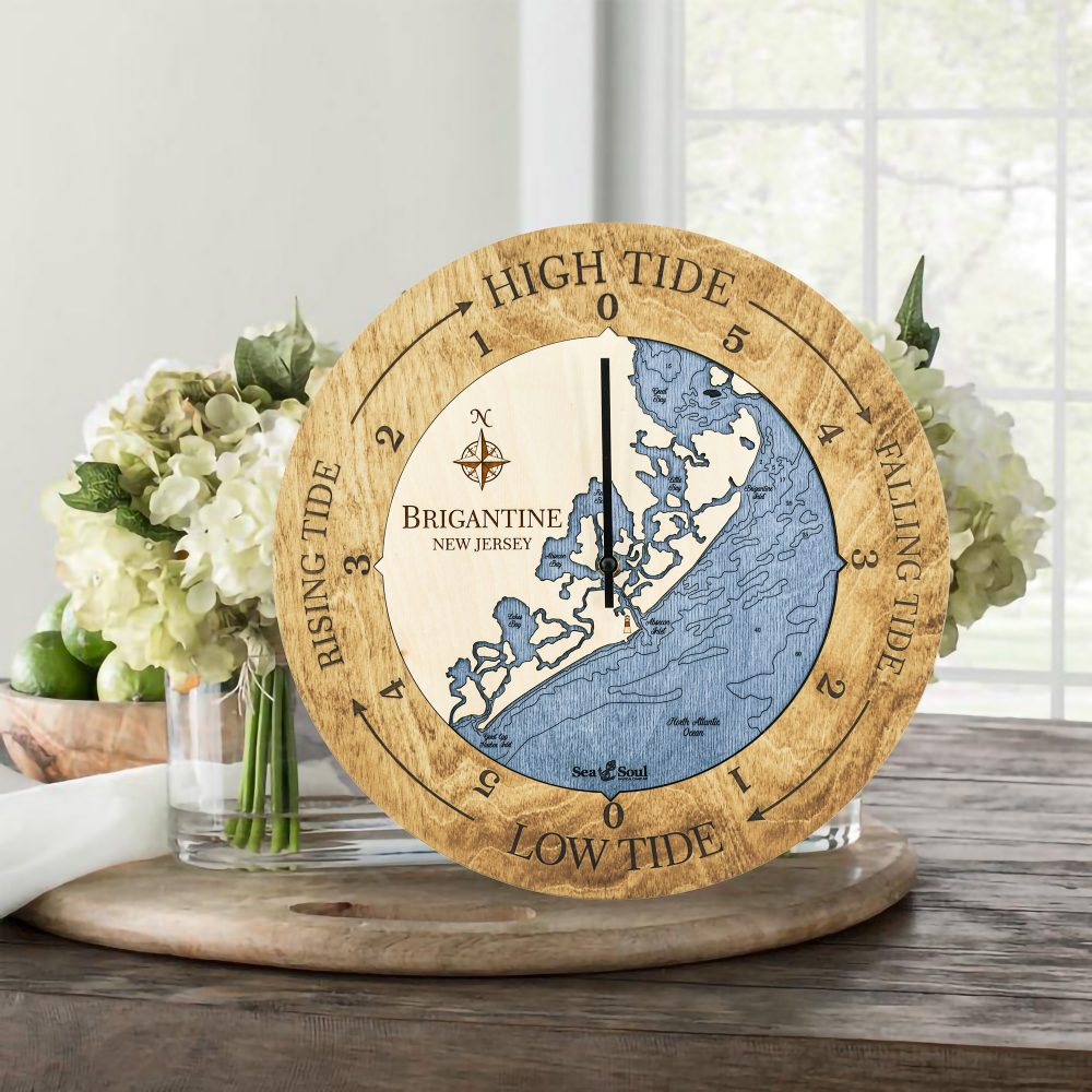 Brigantine Tide Clock Honey Accent with Deep Blue Water Sitting on Table with Flowers