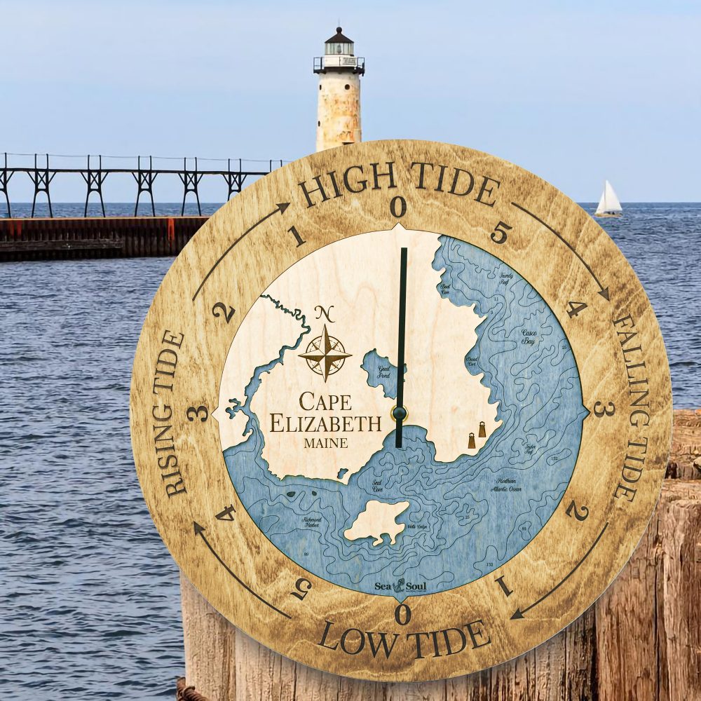 Cape Elizabeth Tide Clock Honey Accent with Deep Blue Water Hanging on Post by Waterfront