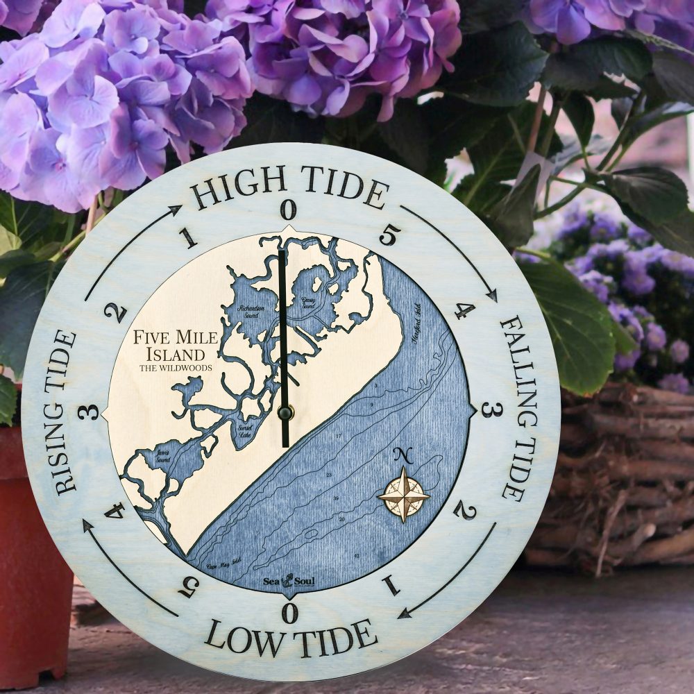 Five Mile Island Tide Clock Bleach Blue Accent with Deep Blue Water Sitting by Flower Pot