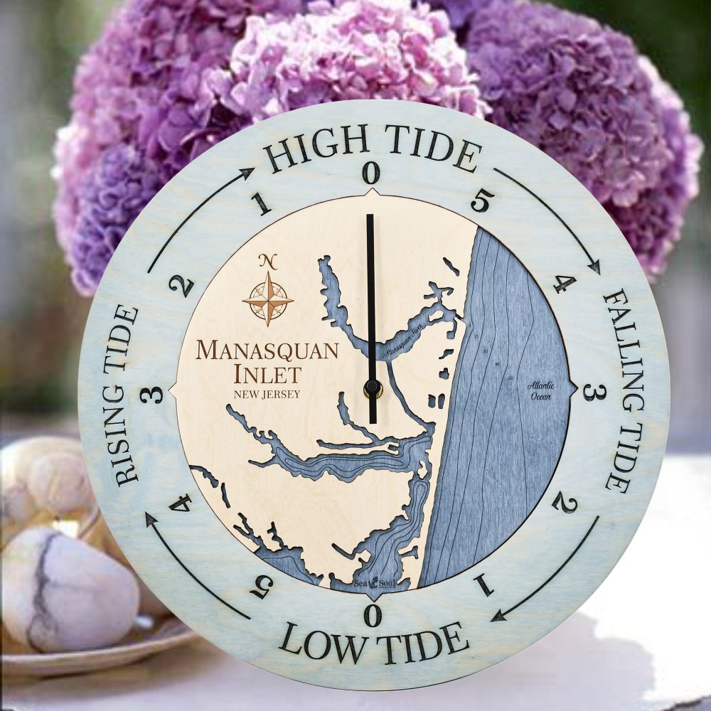 Manasquan Inlet Tide Clock Bleach Blue Accent with Deep Blue Water Sitting on Table with Flowers