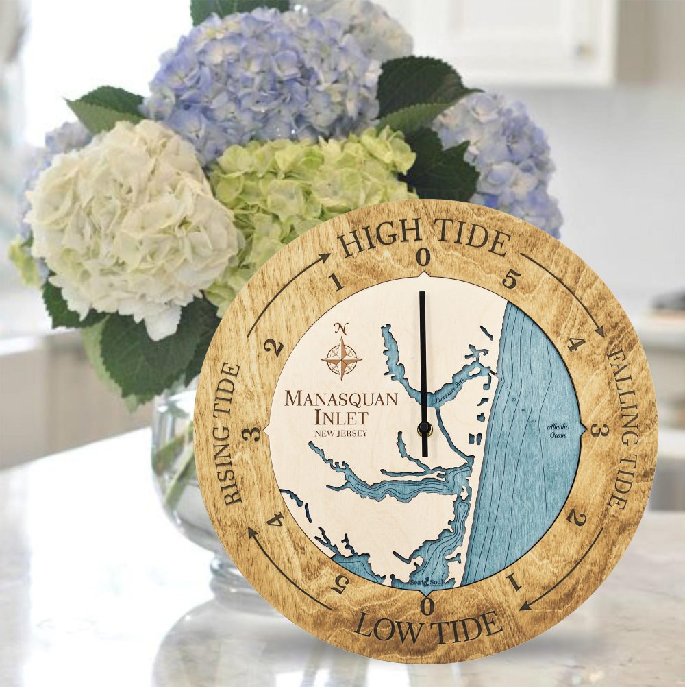 Manasquan Inlet Tide Clock Honey Accent with Blue Green Water Sitting on Countertop with Flowers