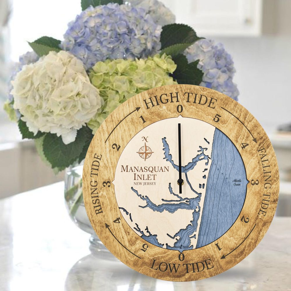 Manasquan Inlet Tide Clock Honey Accent with Deep Blue Water Sitting on Countertop with Flowers