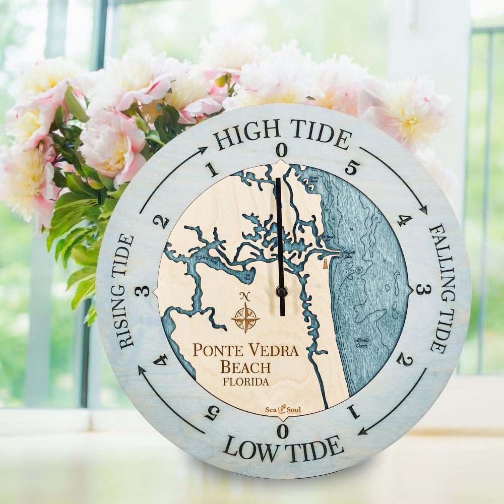 Ponte Vedra Beach Tide Clock Bleach Blue Accent with Blue Green Water Sitting on Windowsill by Flowers