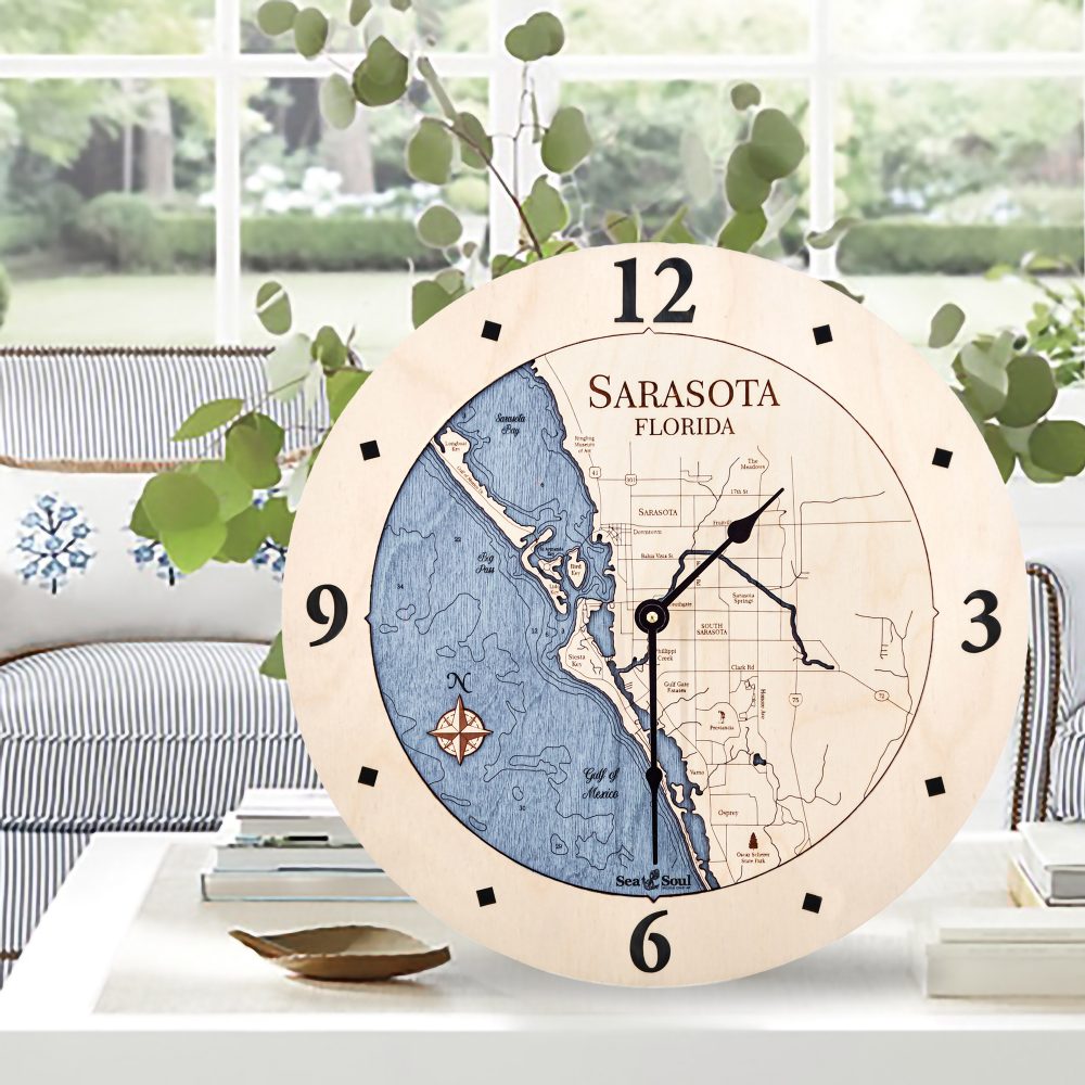 Sarasota Nautical Clock Birch Accent with Deep Blue Water Sitting on Coffee Table