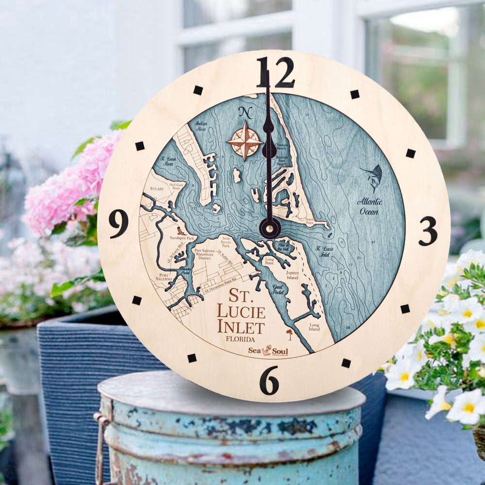 St Lucie Inlet Nautical Clock Birch Accent with Blue Green Water Sitting on Bucket Outside by Flowers