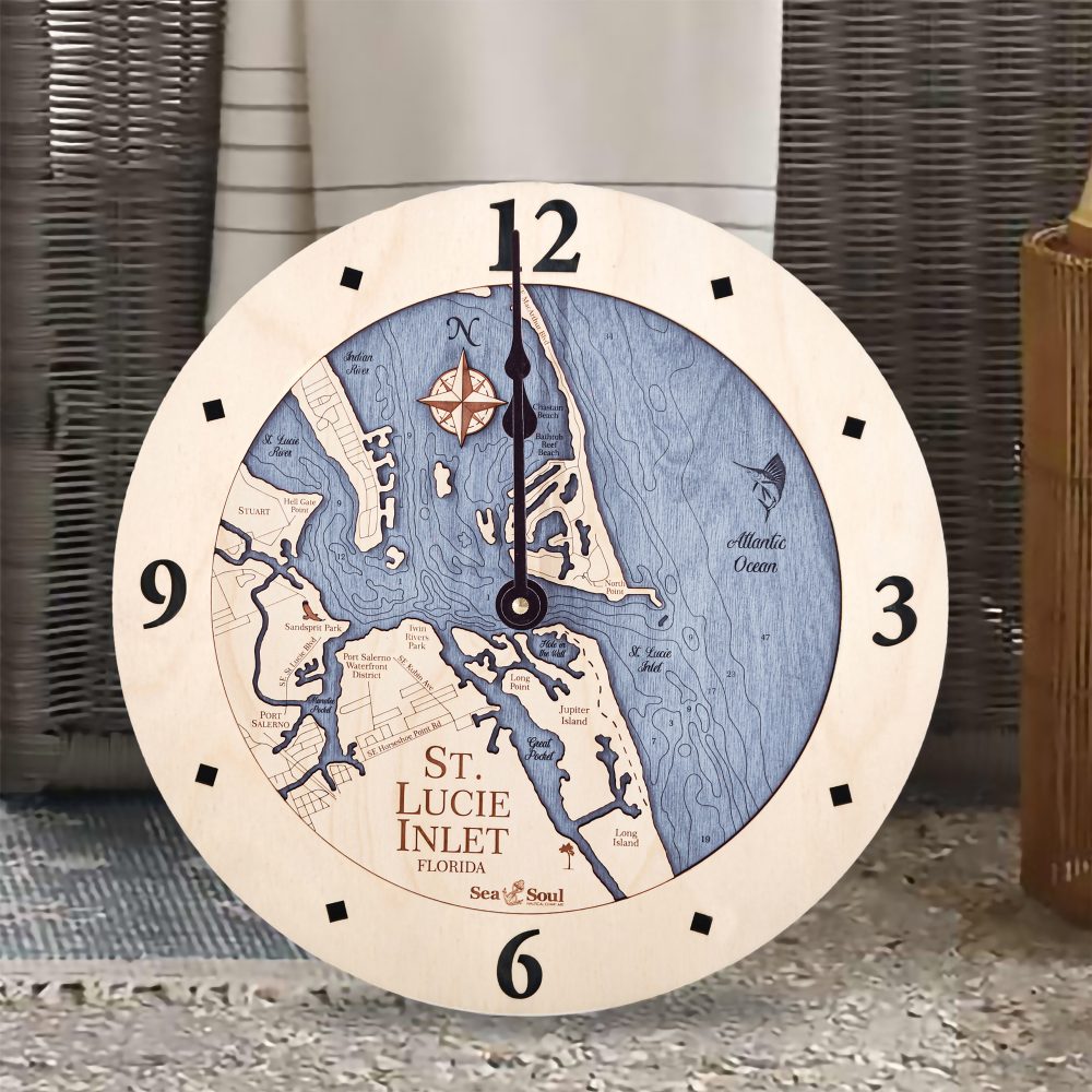 St Lucie Inlet Nautical Clock Birch Accent with Deep Blue Water Sitting on Ground by Wicker Chair