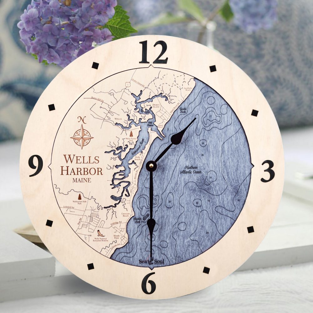 Wells Harbor Nautical Clock Birch Accent with Deep Blue Water Sitting on Table with Flowers