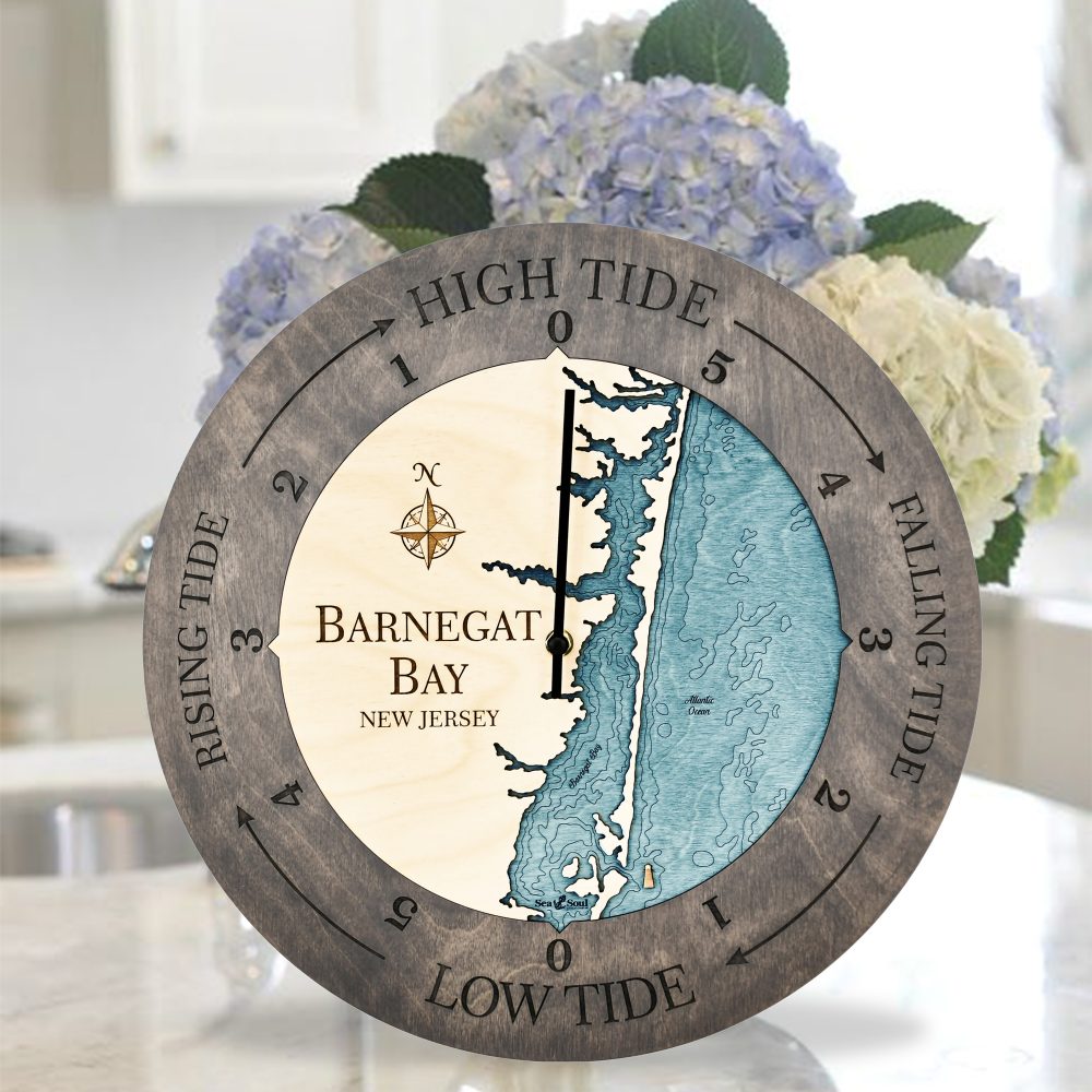 Barnegat Bay Tide Clock Driftwood Accent with Blue Green Water Sitting on Countertop with Flowers