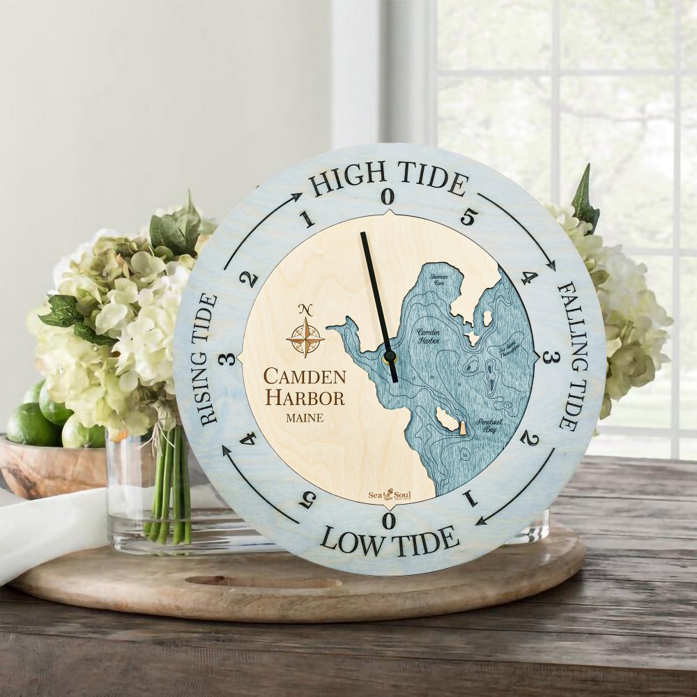 Camden Harbor Tide Clock Bleach Blue Accent with Blue Green Water Sitting on Table with Flowers
